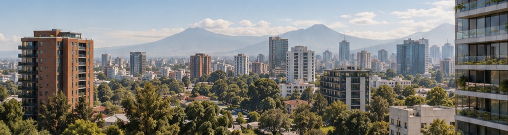 Guatemala City skyline with volcanoes in the distance